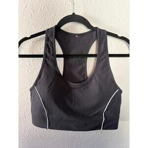 Fabletics black sports bra with removable pads. Best fits tight L